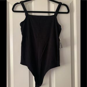 Black thong bodysuit.